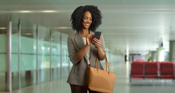 A woman using her motorola device in an office environment.